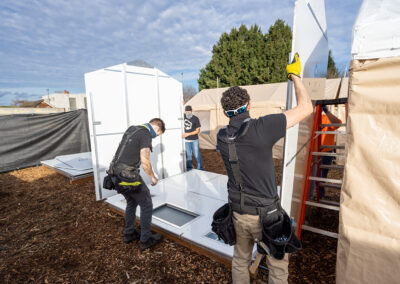 The team from Pallet installing new Pallet Shelters at the Urban Campground, Medford.