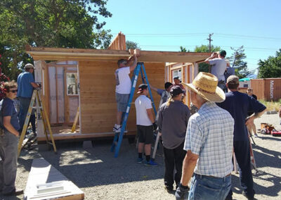 Rogue Retreat volunteers building a tiny home